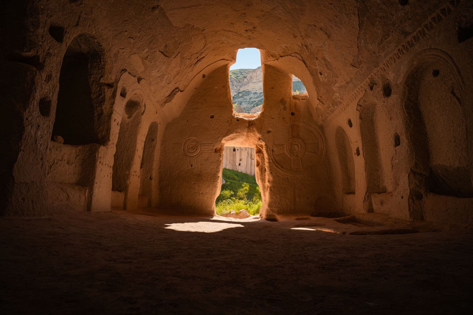 Sunlit interior of a rock-cut church visited on the Cappadocia Blue Tour